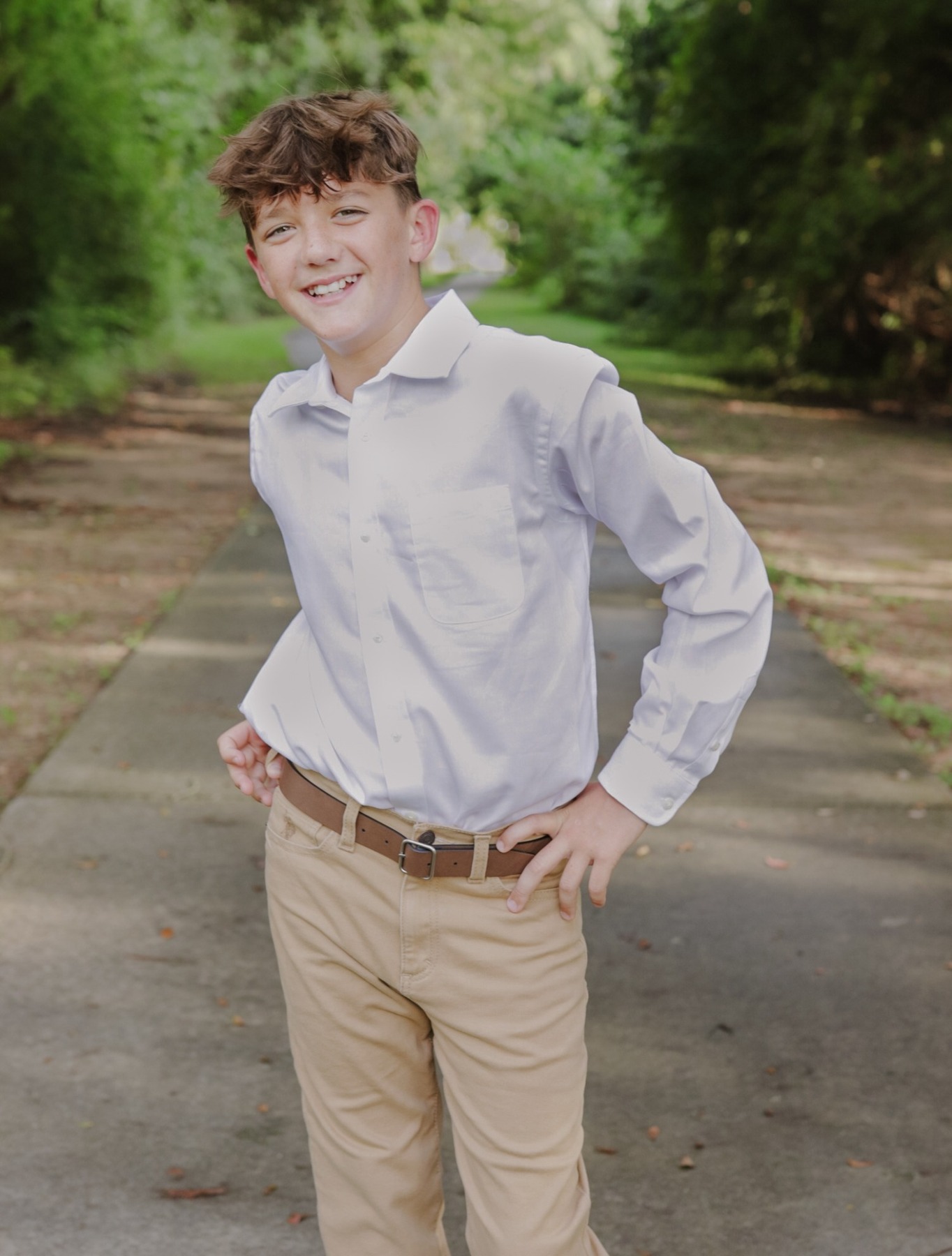 Teen boy smiling during an outdoor portrait session